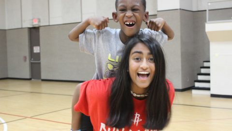 Camper and Volunteer having fun at day camp