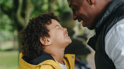 Son and father smiling