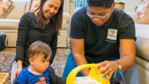 Mother, son and Early Childhood Intervention therapist in session