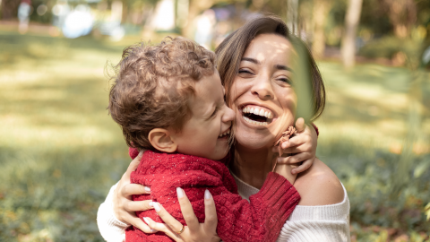 Son hugging smiling mother