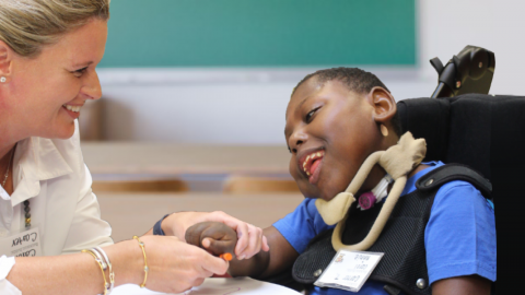 Woman and student smiling