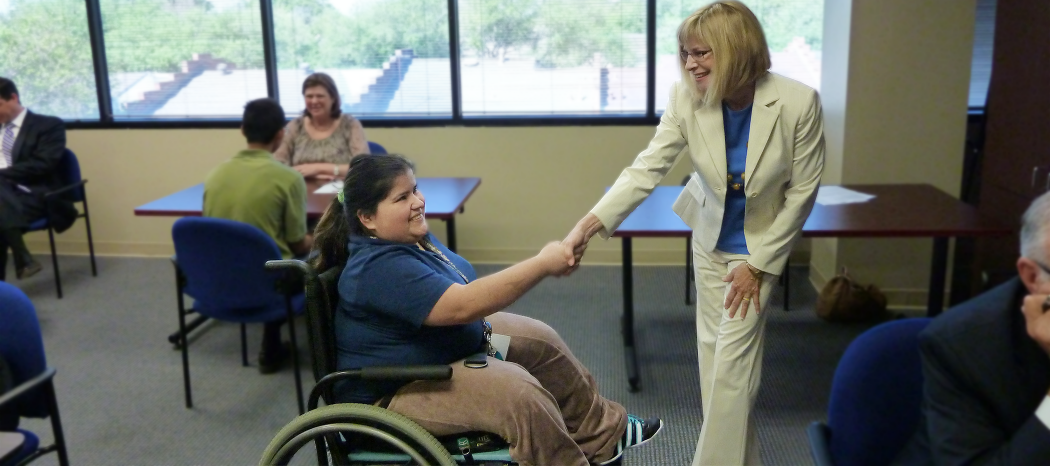 Teen and mentor shaking hands